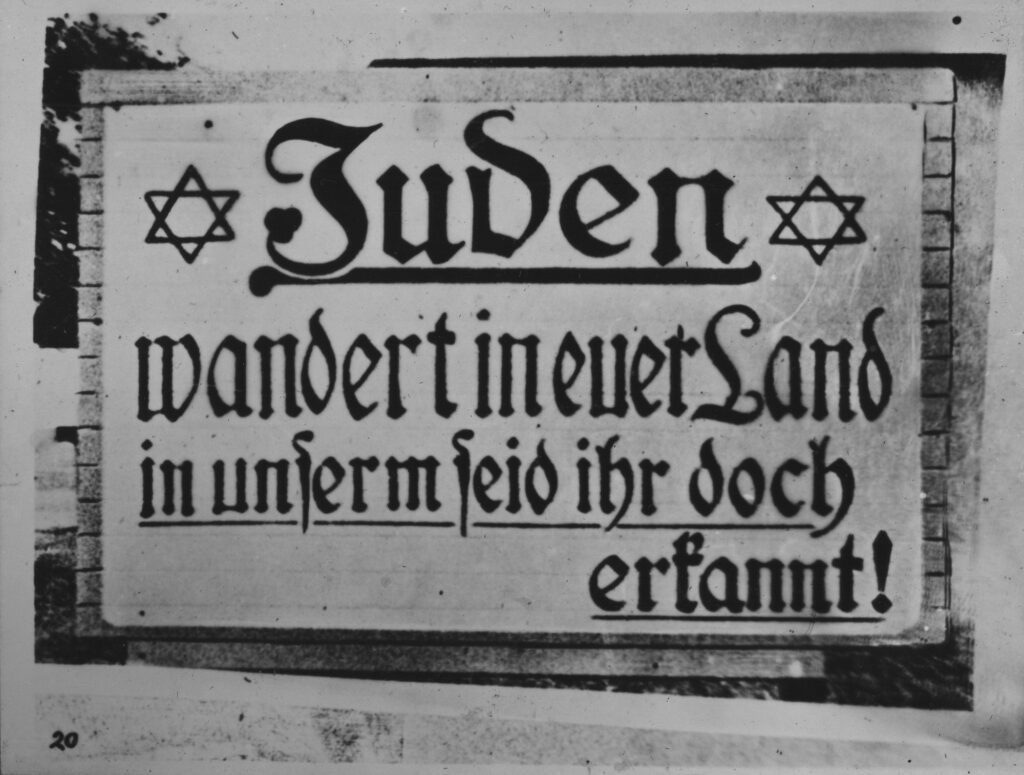 Anti- Semitic banner attached to a wall.